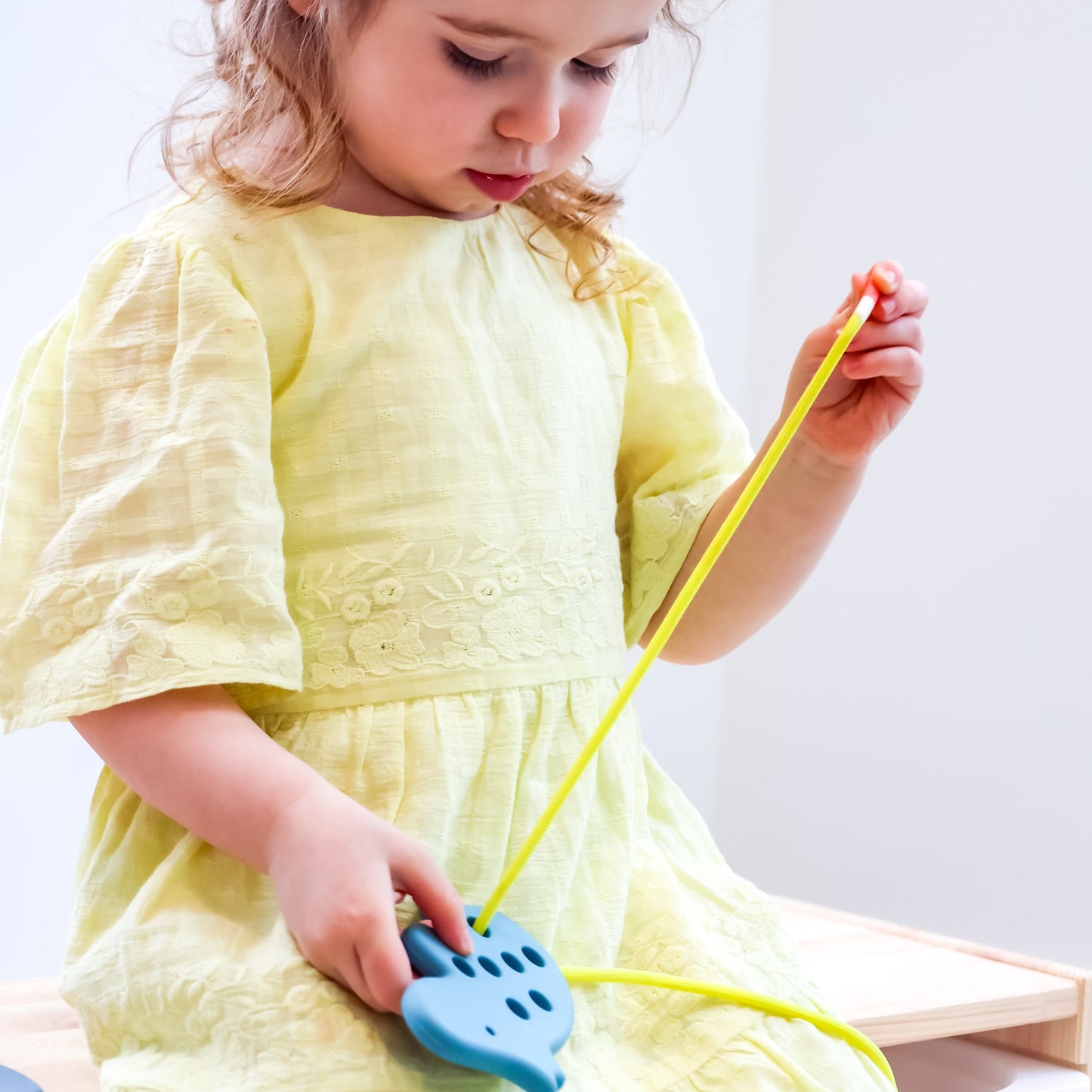 Set of three animal threading toys by Baby Ellor, colorful and safe for children to develop fine motor skills and hand-eye coordination.