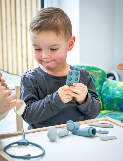 Baby Ellor silicone doctor’s kit for toys and games, featuring colorful pretend medical tools and accessories in a playful set.