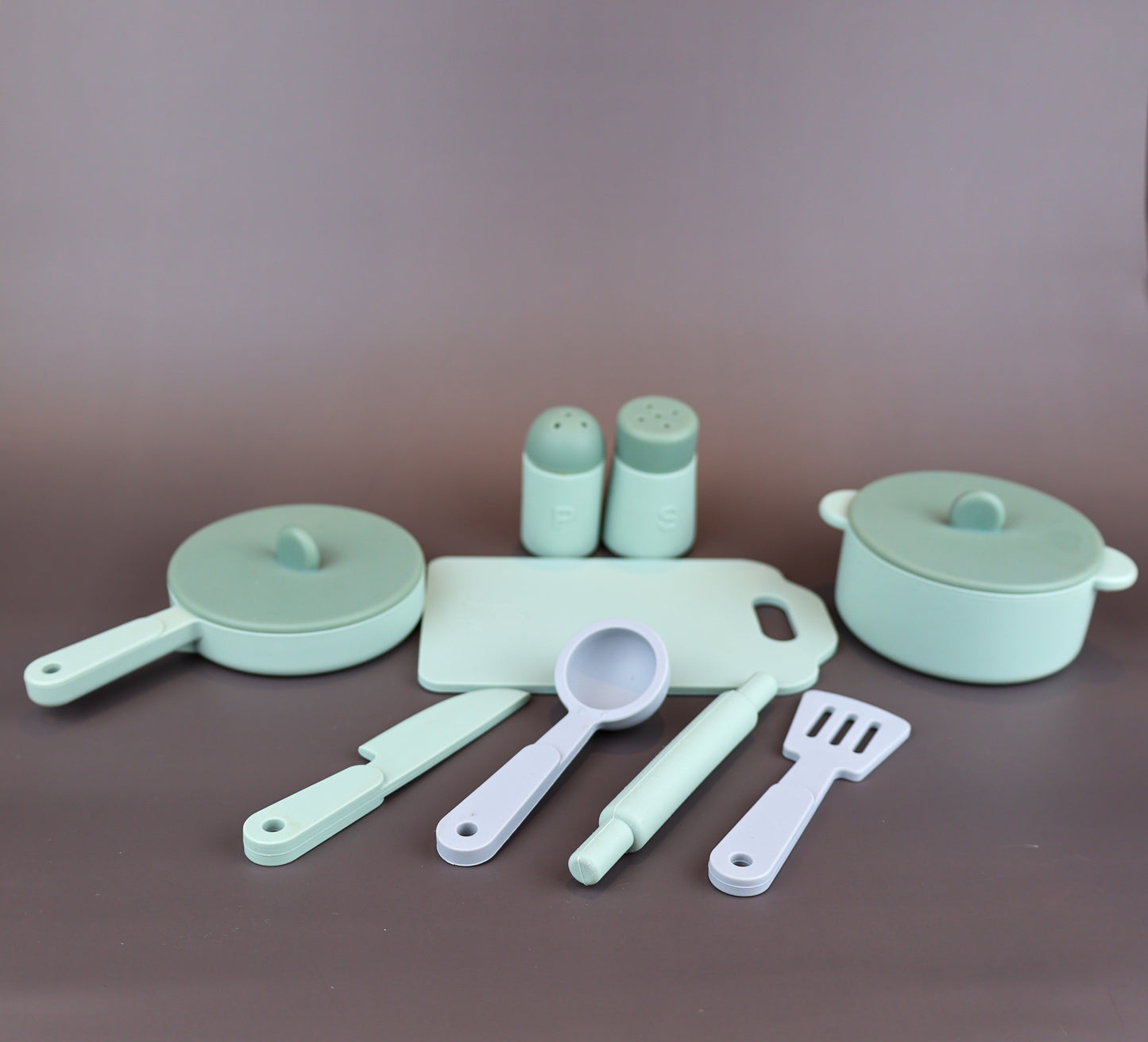 Baby Ellor silicone kitchen play set with colorful toy utensils and cookware for kids' pretend cooking activities.