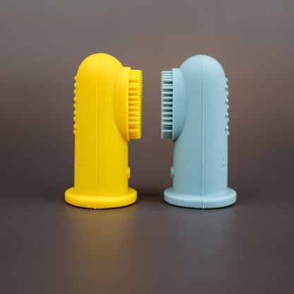Baby Ellor silicone finger toothbrush for babies and toddlers, shown on a child's hand for gentle oral cleaning.