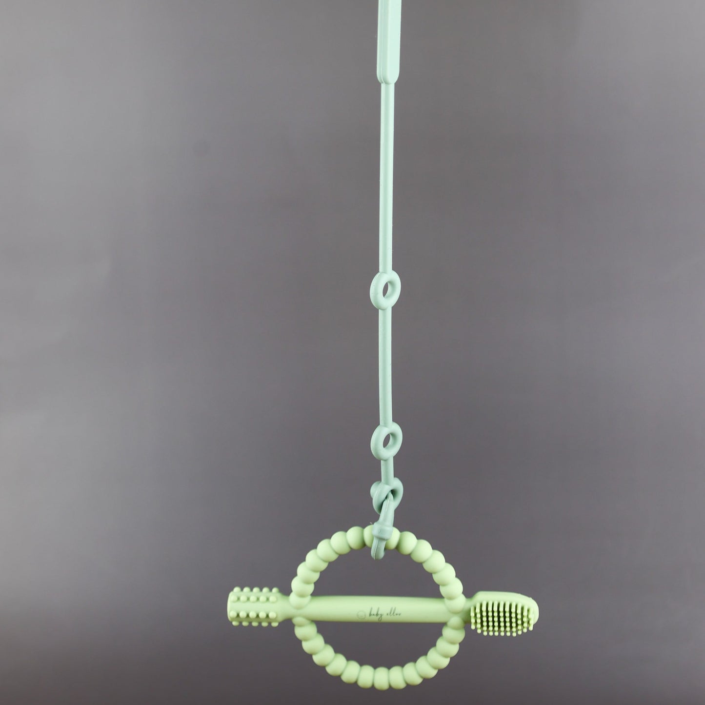 A silicone pacifier strap with a clip and chain design, featuring a pacifier attached to it.