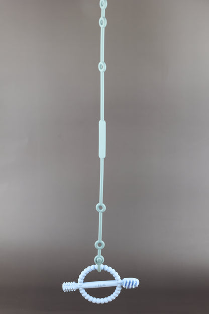 A silicone pacifier strap with a clip and chain design, featuring a pacifier attached to it.