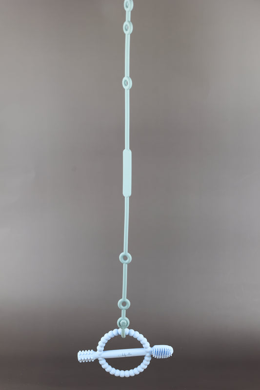 A silicone pacifier strap with a clip and chain design, featuring a pacifier attached to it.