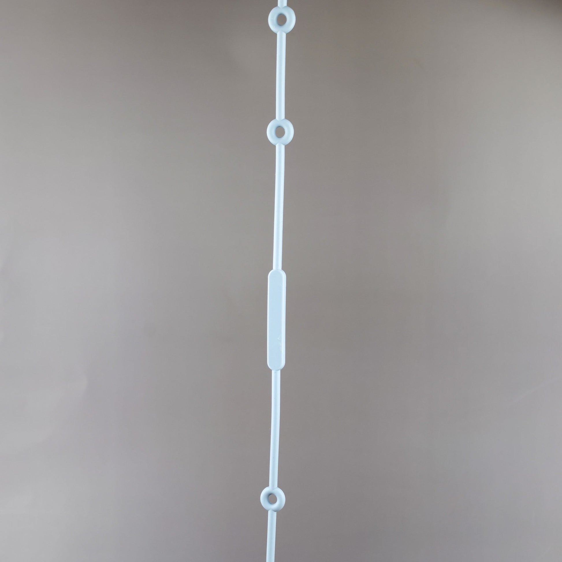 A silicone pacifier strap with a clip and chain design, featuring a pacifier attached to it.