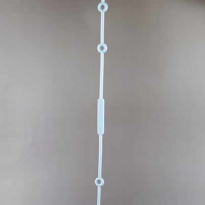 A silicone pacifier strap with a clip and chain design, featuring a pacifier attached to it.