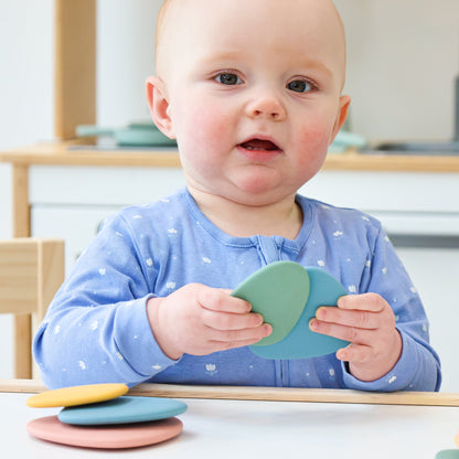 Baby Ellor silicone stacking pebbles toy set with 8 colorful, textured pebbles for developmental play and fine motor skills.