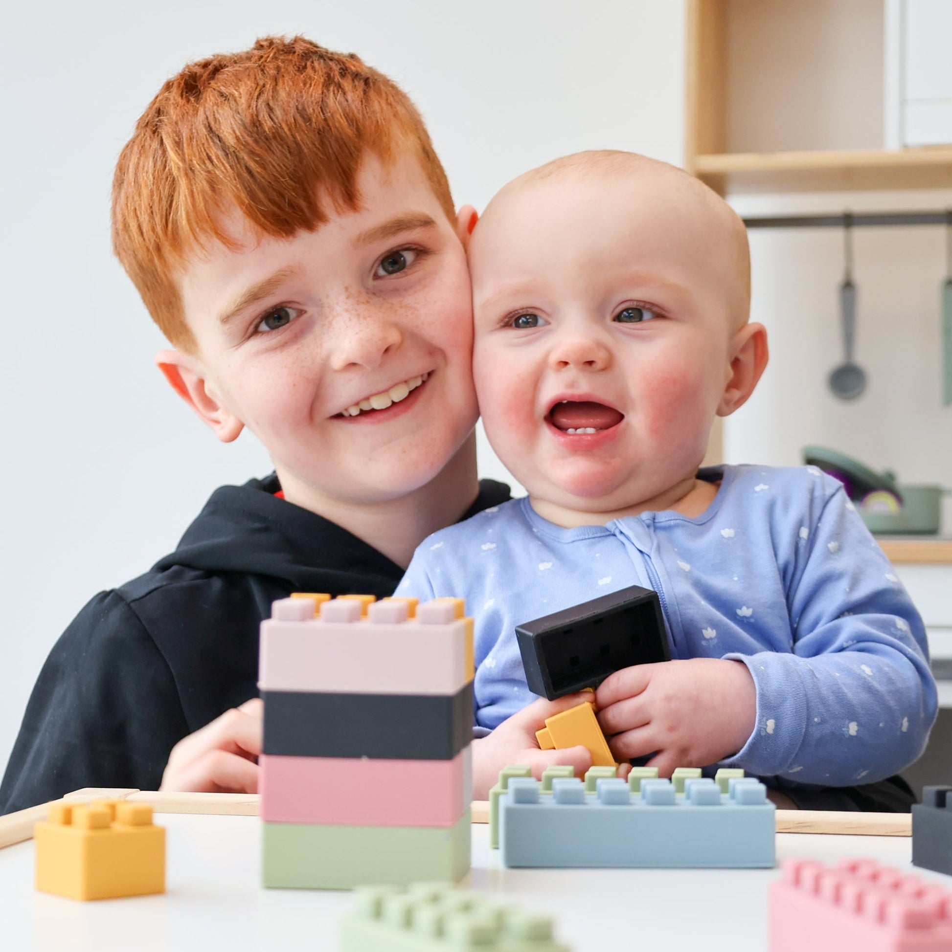 The Little Builders Bundle by Ellor & Co. features colorful wooden building blocks and construction tools for kids.