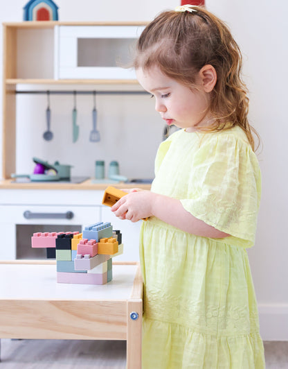 Ellor & Co. Little Builders Bundle with colorful wooden blocks and construction tools for imaginative play.