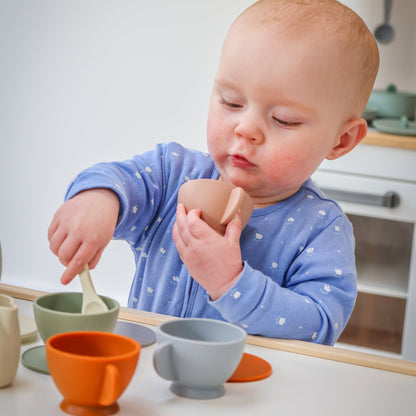 Baby Ellor best seller silicone tea set with colorful cups, teapot, and utensils for children, soft and flexible for play.