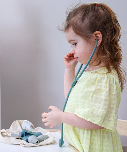 Baby Ellor silicone doctor's kit for kids, includes toy medical tools and accessories in vibrant colors for imaginative play.
