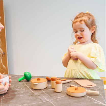 Baby Ellor silicone kitchen play set with colorful utensils, pots, and food toys for imaginative kids' play.