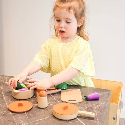 Baby Ellor silicone kitchen play set with colorful toy utensils, pots, and vegetables for kids' imaginative play.
