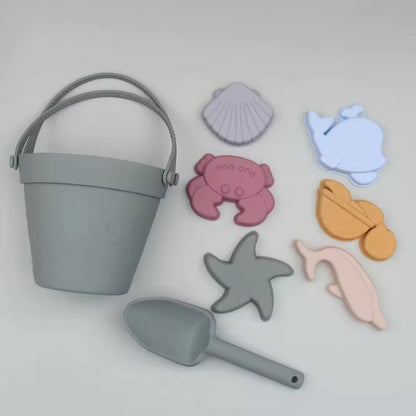Baby Ellor silicone bucket and spades set with six shape moulds for kids' sand play and outdoor fun.