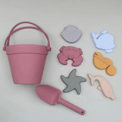 Baby Ellor silicone bucket and spades set with six shape molds for kids' beach or sandbox play.