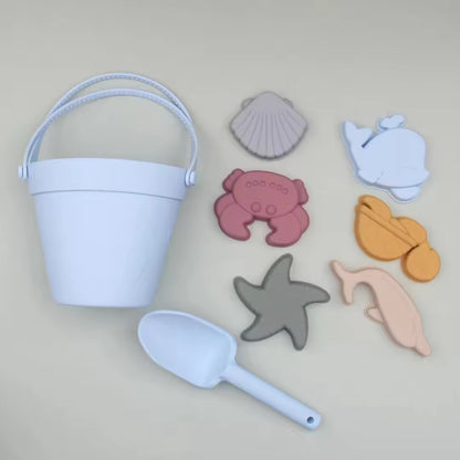 Baby Ellor silicone bucket and spades set with six shape molds, perfect for kids' beach or sand play.