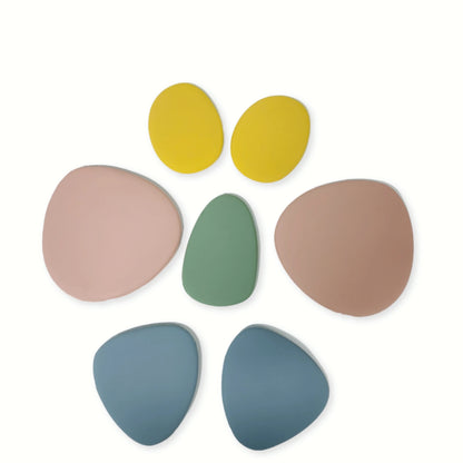 Baby Ellor silicone stacking pebbles toy set with 8 colorful, soft, and durable pebble-shaped building blocks for children.