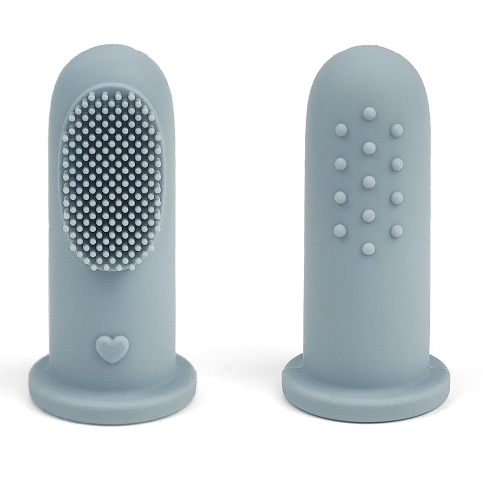 Baby Ellor silicone finger toothbrush for babies and toddlers, showing the soft, flexible brush being worn on a finger.
