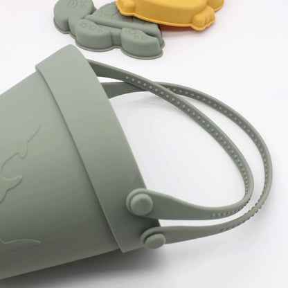 Baby Ellor silicone bucket and spades set with six shape molds, perfect for sand play and outdoor fun with kids.