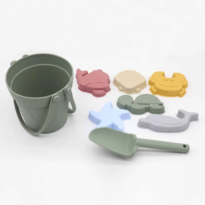 Baby Ellor silicone bucket and spades set with six shape molds, ideal for kids' play and sandcastle building.