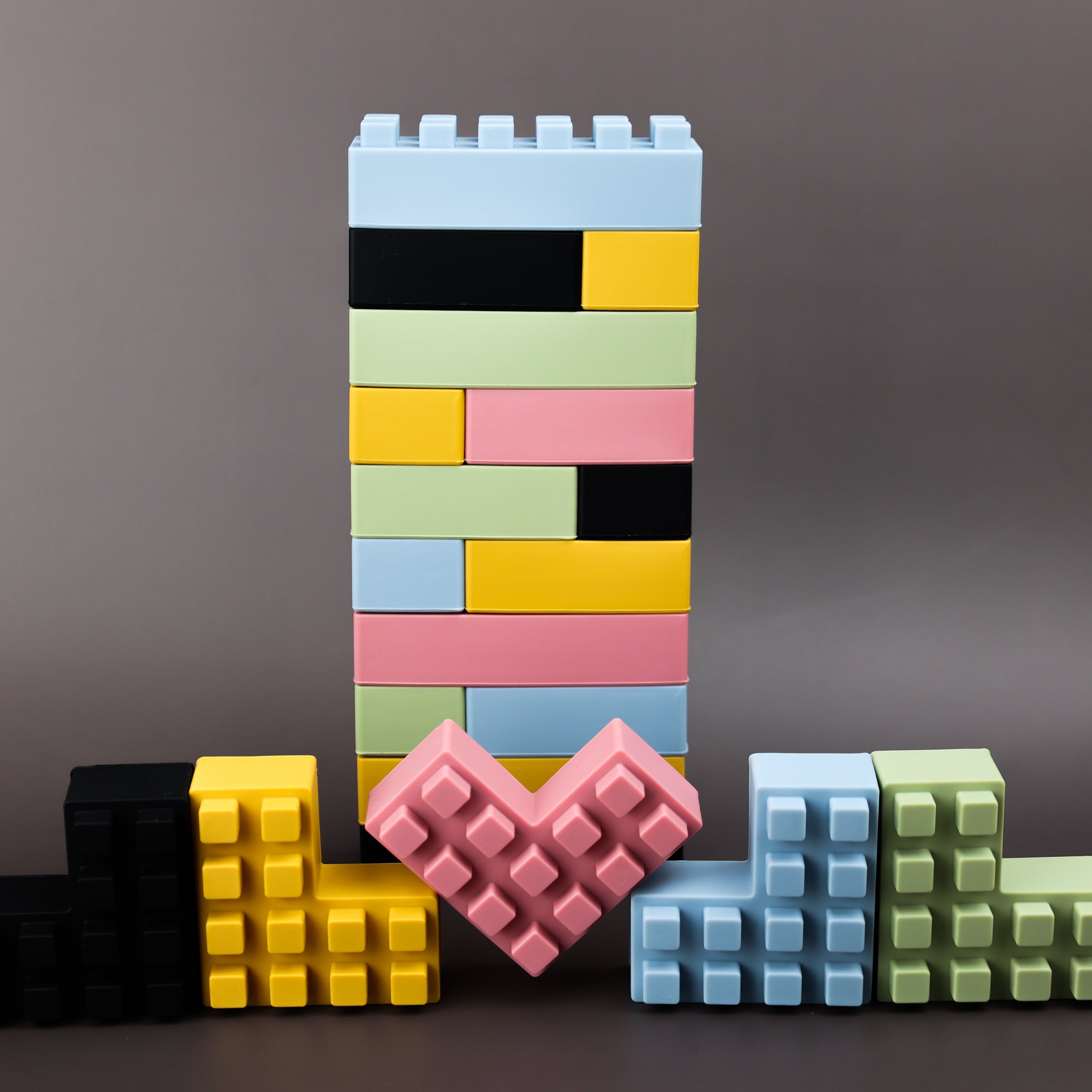 20-piece silicone brick set by Baby Ellor Store, colorful flexible building blocks for kids, arranged in a playful stack.
