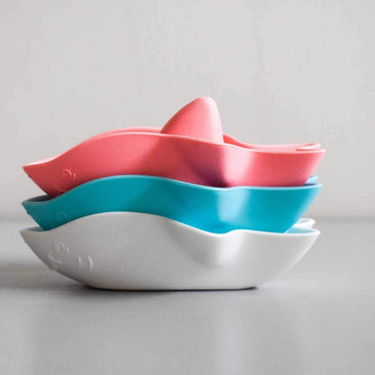 Baby Ellor silicone shark bath toy floating in water, colorful and soft for children's bath time fun.