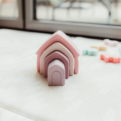 Colorful silicone baby toys from Ellor & Co. in a collection, soft textures and playful shapes for infants.