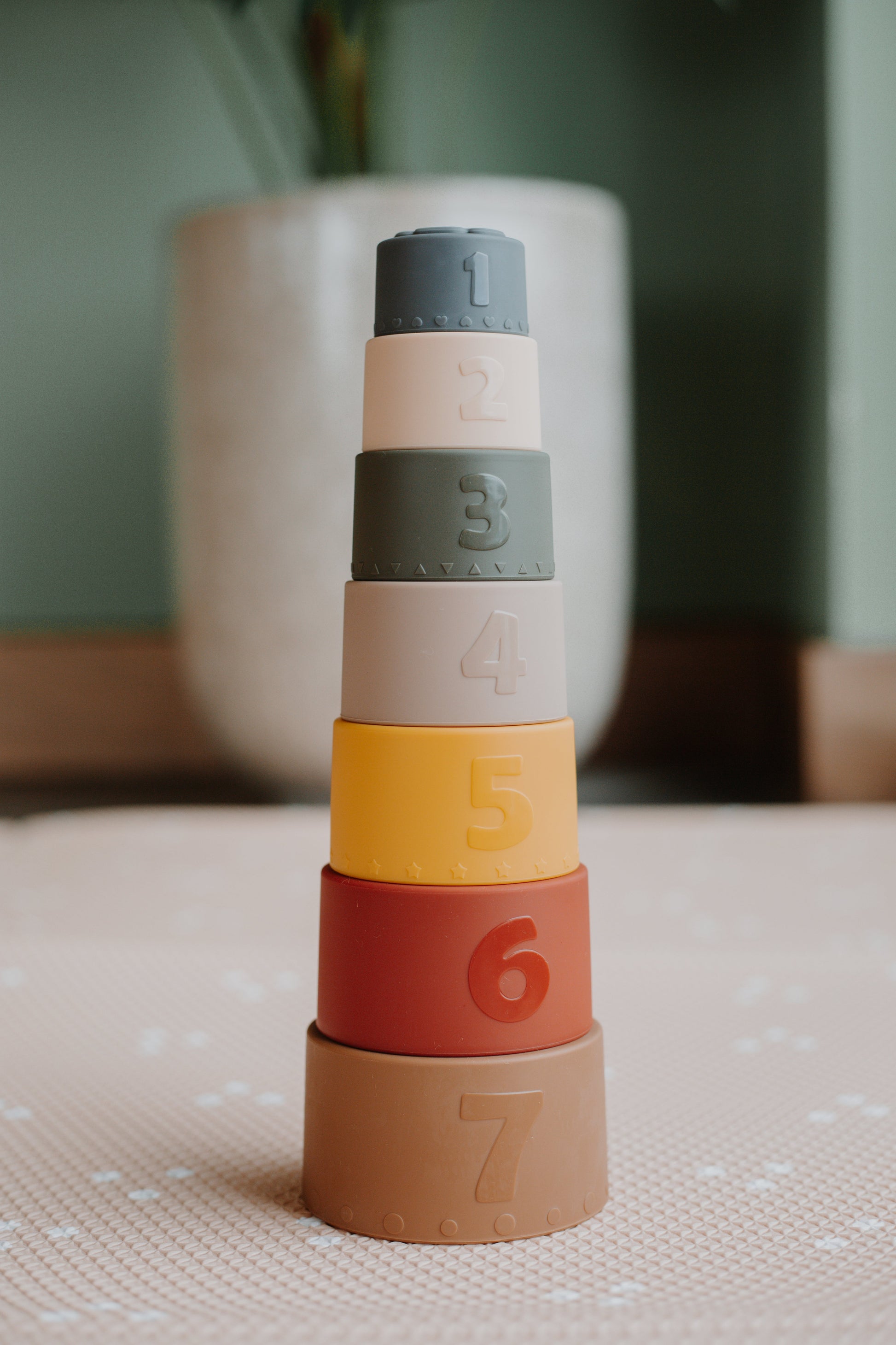 Ellor & Co. Water Play Bundle with colorful water toys and accessories for kids, displayed on a wooden surface.
