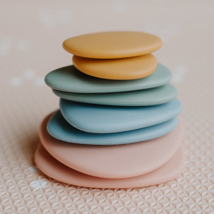 Baby Ellor silicone stacking pebbles toy set with 8 colorful, smooth, stackable pebbles for toddlers and early childhood play.