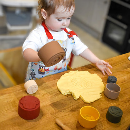 Colorful silicone stacking cups by Ellor & Co. arranged in a playful tower, ideal for kids' toys and games.