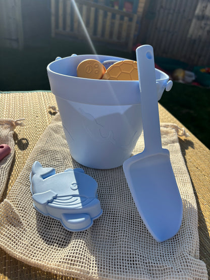 Baby Ellor silicone bucket and spades set with six shape molds, perfect for children's sand play and outdoor activities.