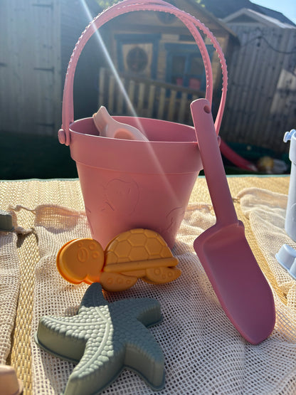 Baby Ellor silicone bucket and spades set with six shape molds, ideal for beach or sandbox play.